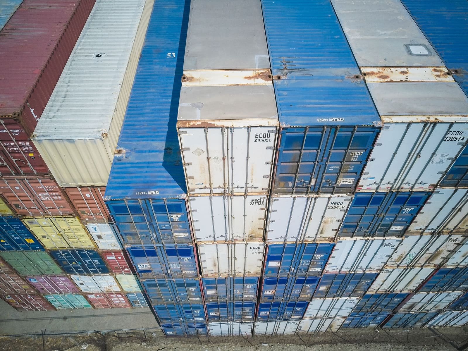 Stacked shipping containers ready for customs processing